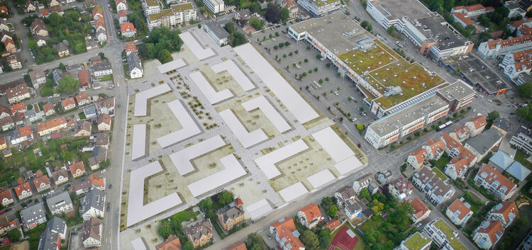 Auf den weißen Flächen entstehen bis 2021 nach und nach rund 70 Gebäude.Luftbild: Bernd Stelzer / Foto-Montage: Carsten Riedl