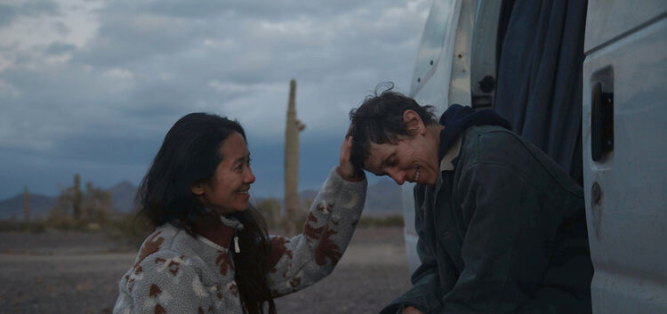 FILE - In this file photo, Director Chloe Zhao, left, appears with actress Frances McDormand on the set of "Nomadland."  “Nomadl